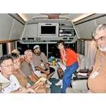 Florida amateur radio evening briefing 9-8-2005 fills RV <br> of Bill KI4JOG at EOC in Hancock Co., Miss. <br>L>R: George KU3O, Daisy KT4TW, Ricky KD4AST, <br> Don WU9T, Bill KG4ZJT, Mary KI4JOO, Ray K1HG. <br> Six Tallahassee area hams stood behind photographer.