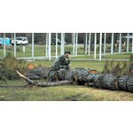 National Guardsman phones home amidst Katrina damage <br> at Hancock Co., Miss. Emergency Operations Center.<br> Radio replaced cell and land lines during early <br> stages of recovery from Hurricane Katrina.