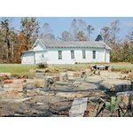 Church moved off foundation (foreground) and ended up across road.