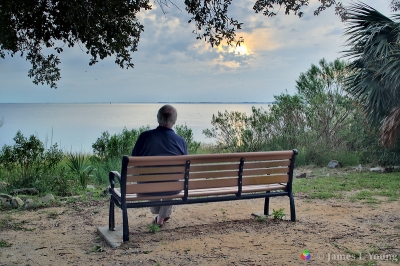 Visitor watches sunset from Ranger John McKenzie's bench. (9/16/2015) - St. Marks National Wildlife Refuge.